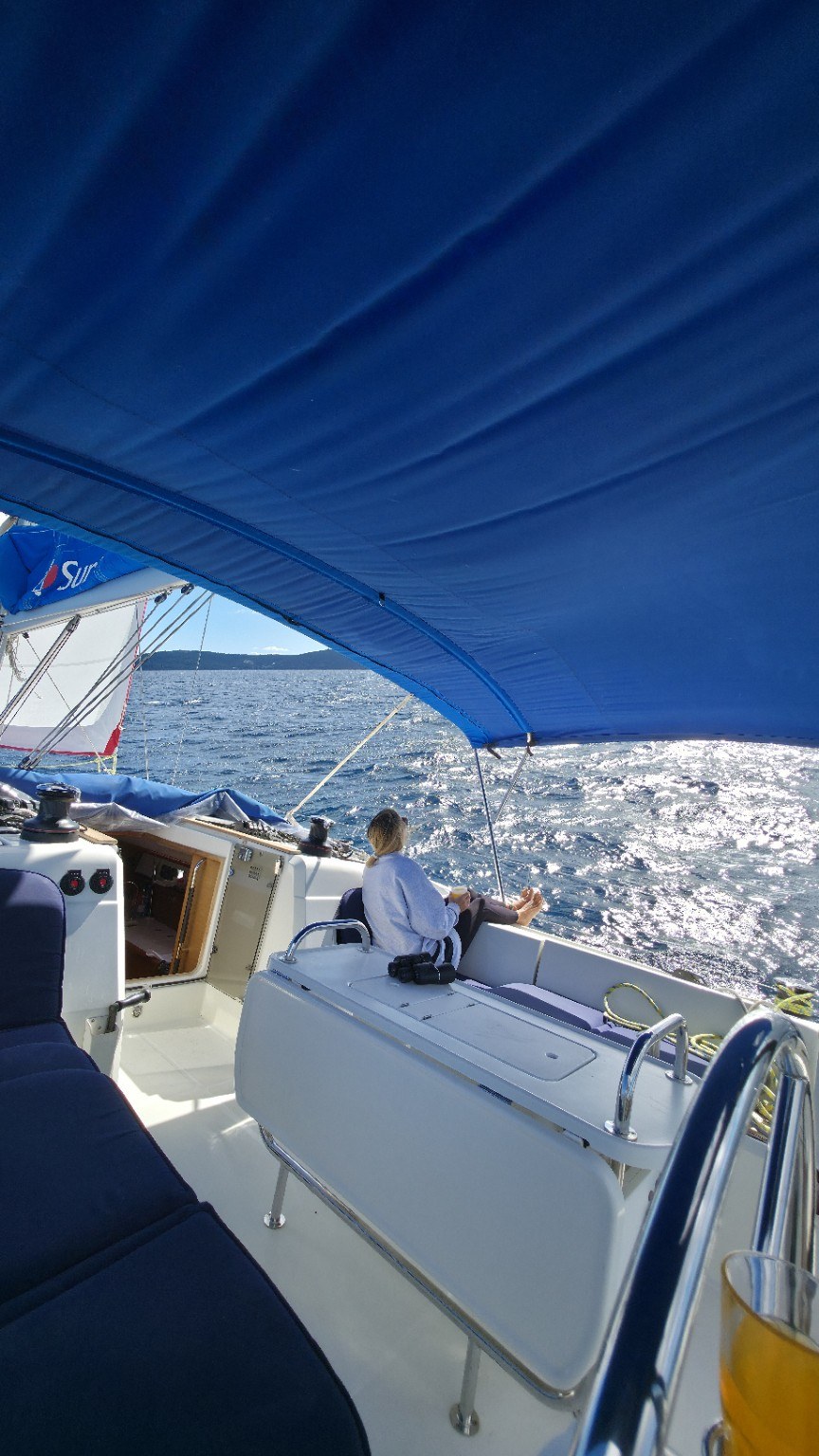 Guests actively sailing a yacht on a skipper-led sailing adventure