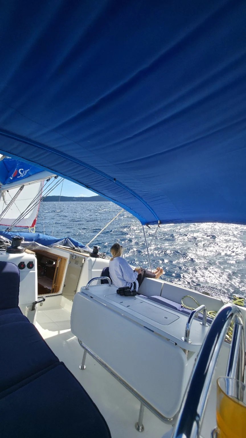 Relaxing in a sailing yacht cockpit during a private group holiday